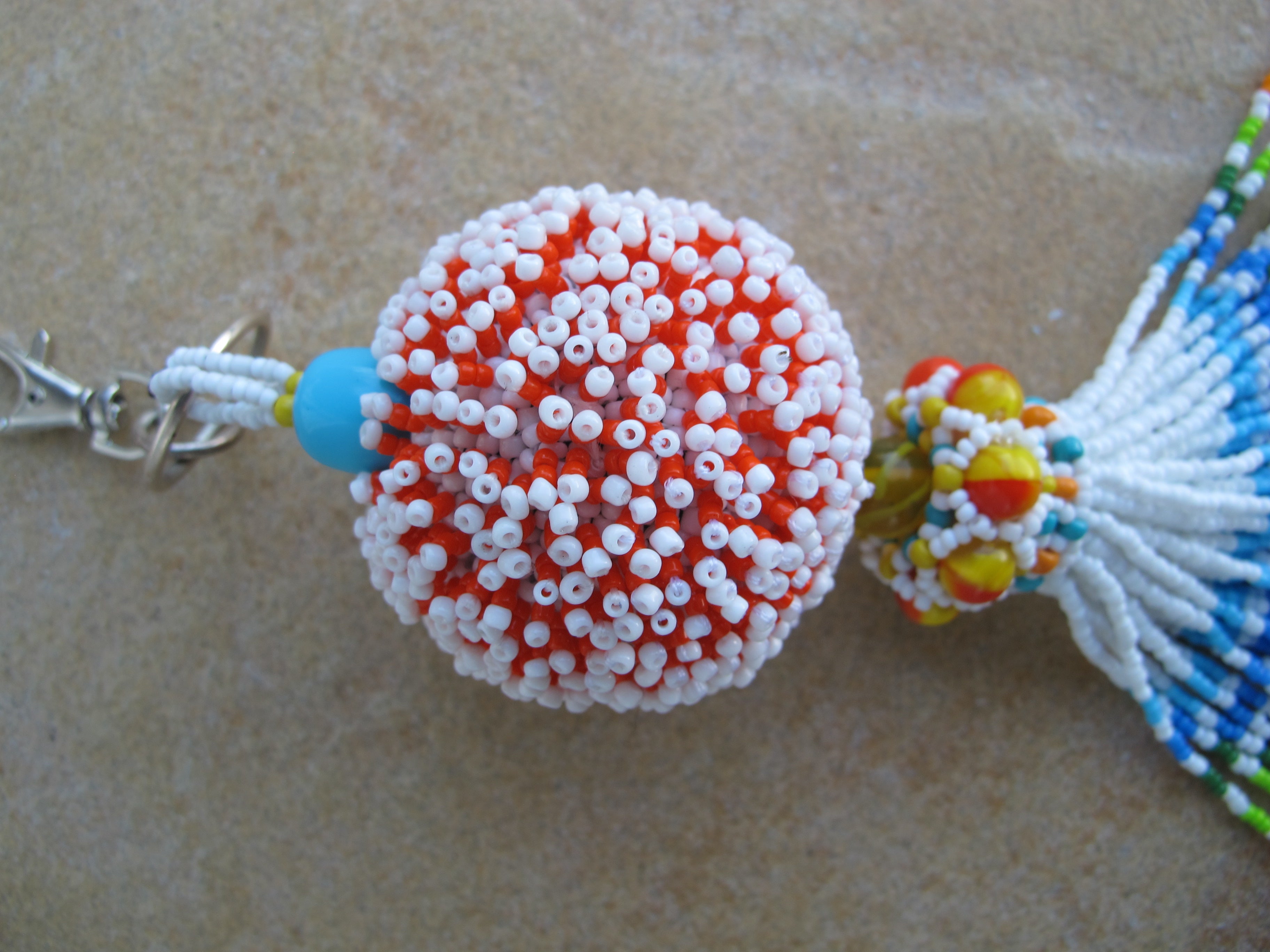 Beaded Bead Keychain in White, Orange and multicolored beaded tassel